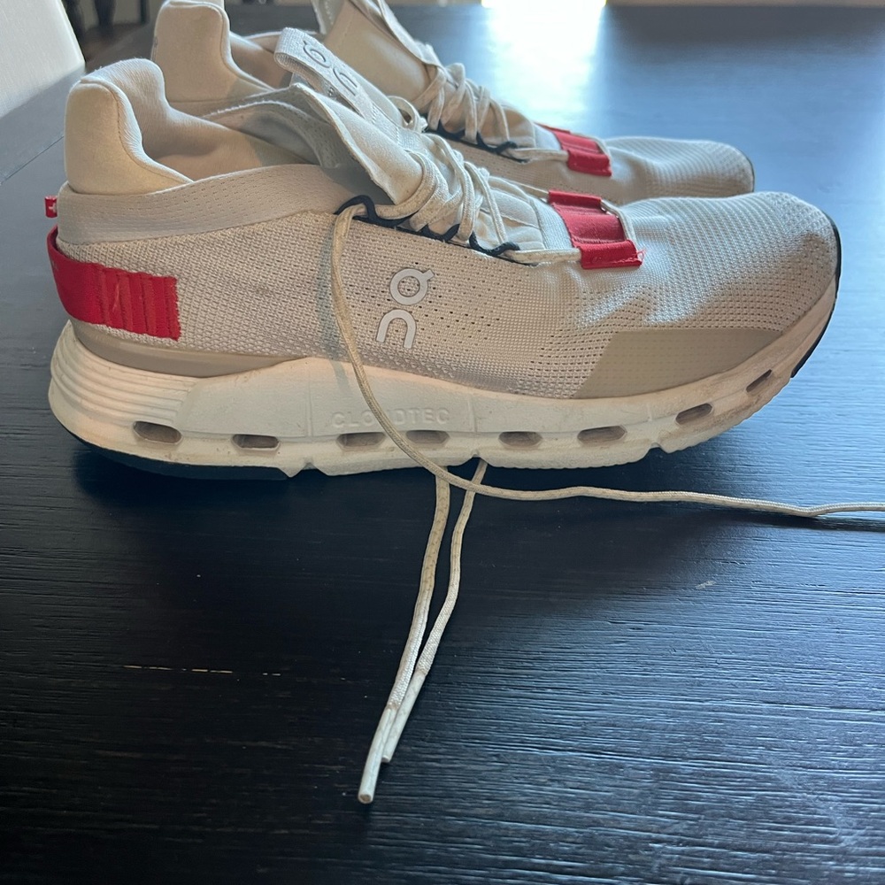 On Running Cream and Red Athletic Shoes